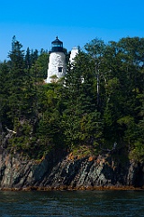 Eagle Island Lighthouse Tower Over Cliffs in Maine
